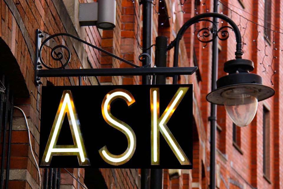 lamp post sign with the word "ask". Header image for "Market Research Advice"
